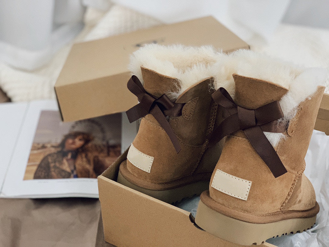 Botas de nieve de piel de oveja con una sola cinta para mayor calidez